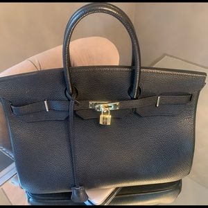 Black leather designer inspired bag.